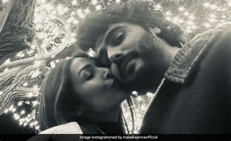 New Year Malaika Arora And Arjun Kapoor Seal It With A Kiss In