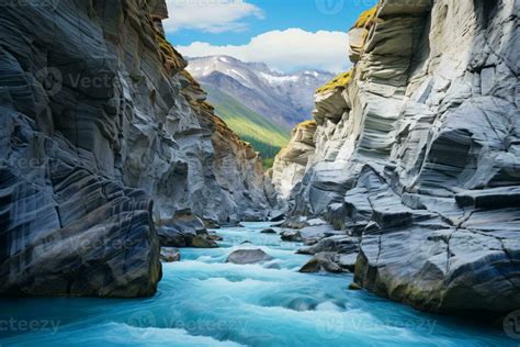 A Majestic River Flowing Through A Breathtaking Canyon Surrounded By