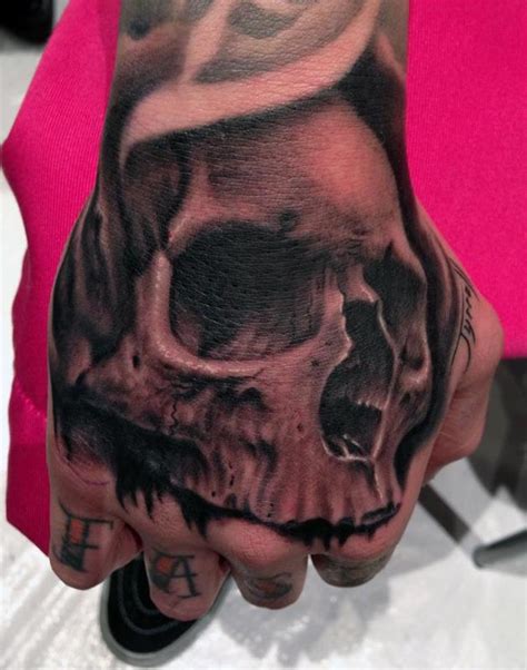 Skull Hand Tattoo By Bob Tyrrell Tattoos