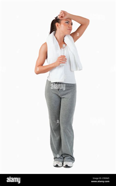 Young Woman Wiping Off Sweat From Her Forehead Stock Photo Alamy