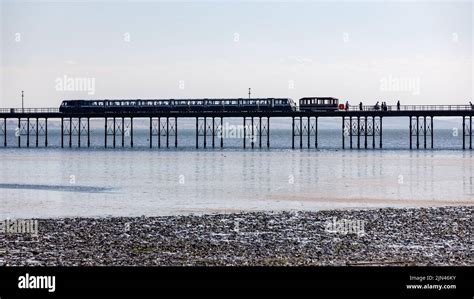 Southend Beach and Pier at low tide on a bright sunny summers day with ...