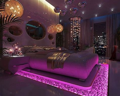 A Large Bed Sitting In A Bedroom Next To A Window With Lights On The Ceiling