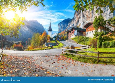 Stunning Autumn View Of Lauterbrunnen Village With Awesome Waterfall