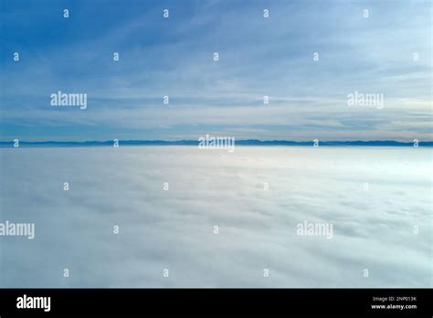 Aerial View From High Altitude Of Earth Covered With White Puffy