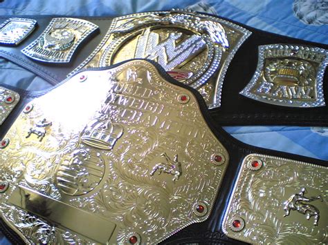 Wwe Spinner Championship And The World Heavyweight Championship Belt