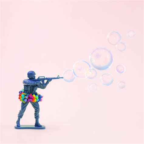 Toy Soldier Shooting Bubbles From Gun by Juj Winn