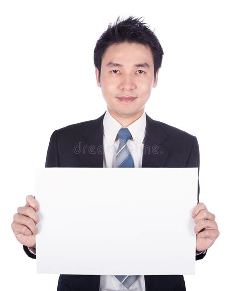 Business Man Holding A Blank Paper Sheet Isolated On White Stock Photo