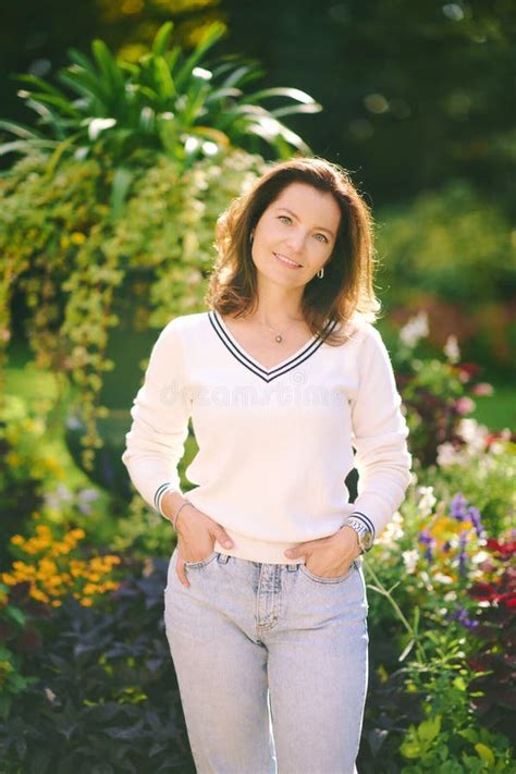 Outdoor Portrait Of Happy Beautiful 40 45 Year Old Woman Stock Photo