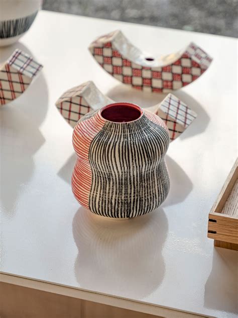 ceramic artist's wood-clad studio extends 80s-built house in the UK