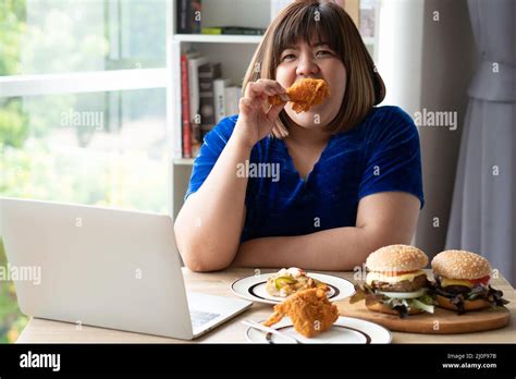 Obese Woman Eating Fast Food Chicken Hi Res Stock Photography And