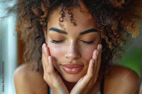 A Vulnerable Woman Gazes Into The Camera Her Face Adorned With Expertly Applied Makeup And Her