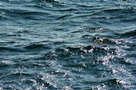 Abstract Texture Of Rippling Clear Blue Ocean Water Surface With Low