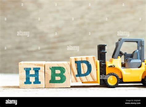 Toy Forklift Hold Letter Block D To Complete Word HBD Abbreviation Of