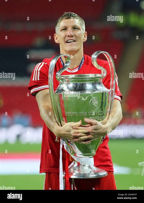 Munich S Bastian Schweinsteiger Celebrates With The Trophy During The