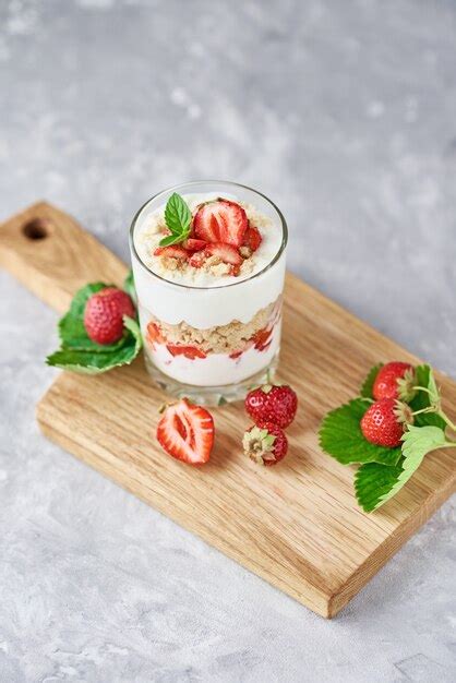 Premium Photo Strawberry Granola Or Smoothie In Glass And Fresh