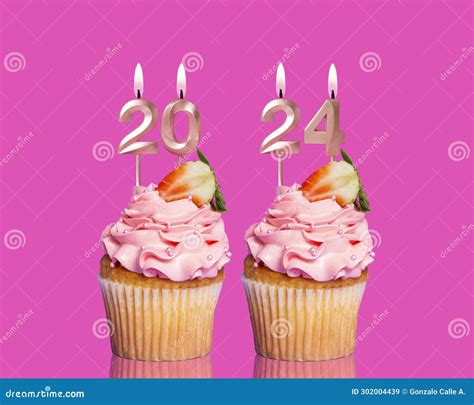 Cupcake With Candles Forming Number 2024 For Happy New Year New Year