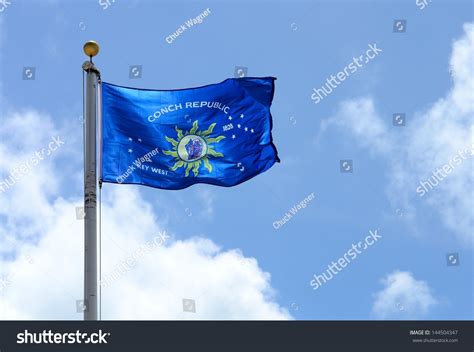 Flying Flag Of The Conch Republic Key West Florida Against A Blue