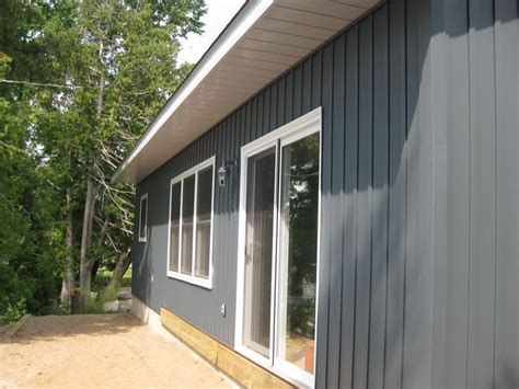 Midnight Surf Siding With White Trim Renovated By Lakeridge Design And Construction Siding