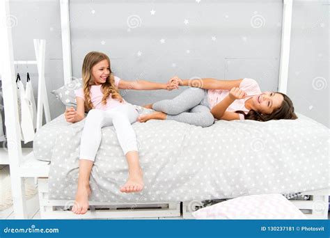 Sisters Or Best Friends Spend Time Together In Bedroom Girls Having