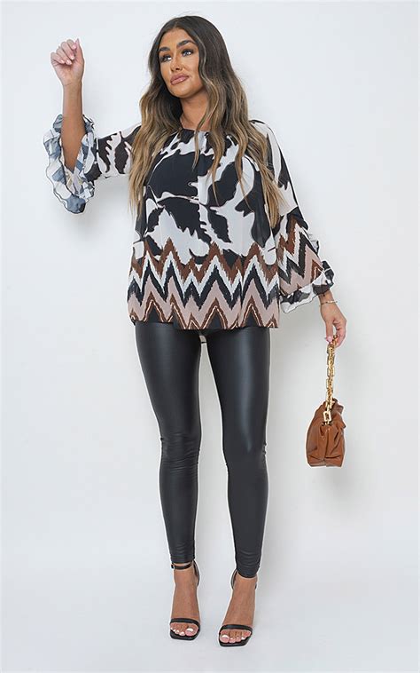 Celeste Allover Print Flounce Sleeve Blouse In Black Ikrush