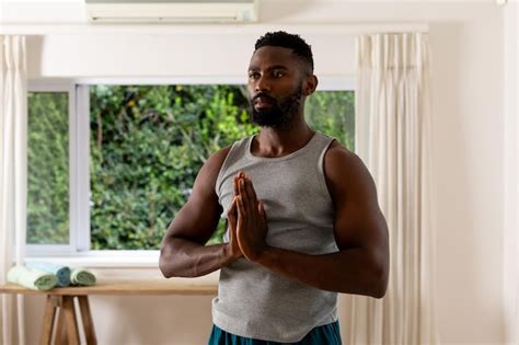 Premium Photo African American Man Practicing Yoga Meditation At Home