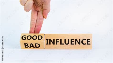 good  bad influence symbol businessman turns cubes  changed words