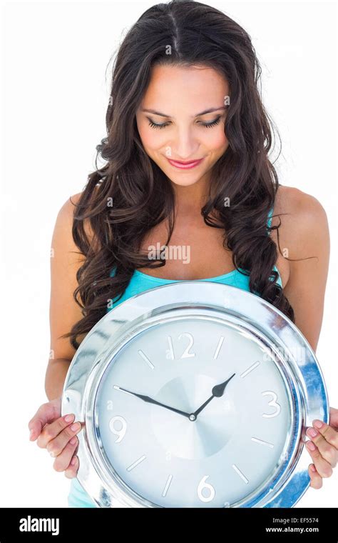 Pretty Brunette Holding A Clock Stock Photo Alamy