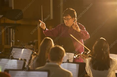 conductor leading orchestra stock image  science photo