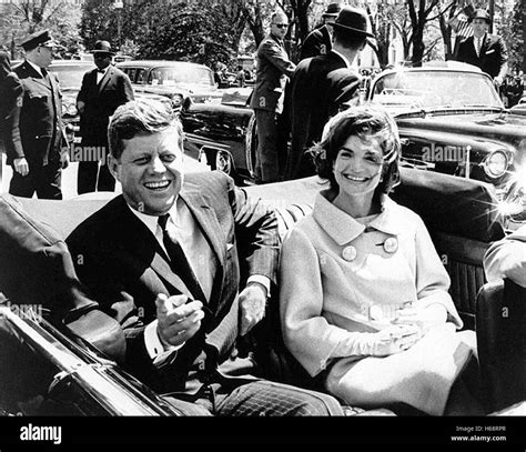 President John F. Kennedy and Jacqueline Kennedy in open top ...