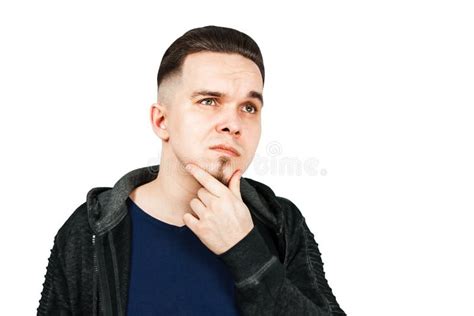 Thinking Man Holds Hand At Face Isolated On White Background Closeup