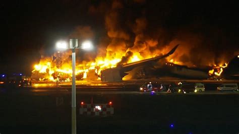 Japan Airlines Hundreds Survive After Plane Bursts Into Flames On Tokyo Runway Bbc News