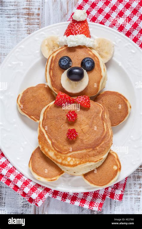 Funny bear pancakes with berries for kids breakfast Stock Photo - Alamy