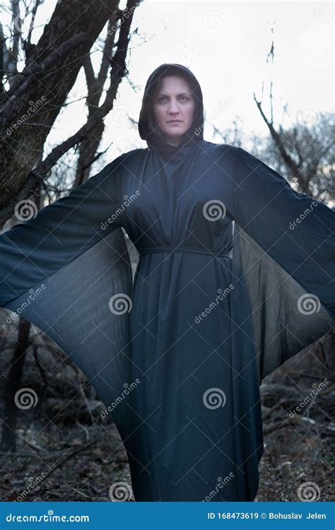 Hooded Woman In Black Robes Deep In The Forest Witches Halloween And