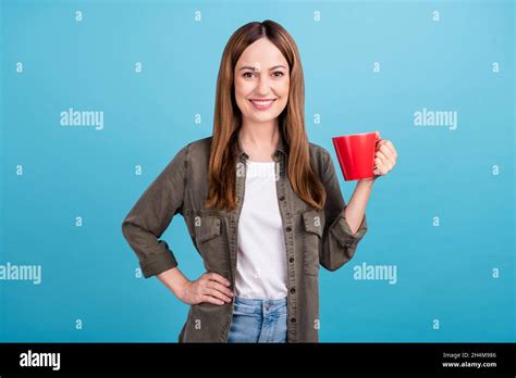 Photo Of Joyful Pretty Mature Woman Hold Cup Of Tea Good Mood Smile