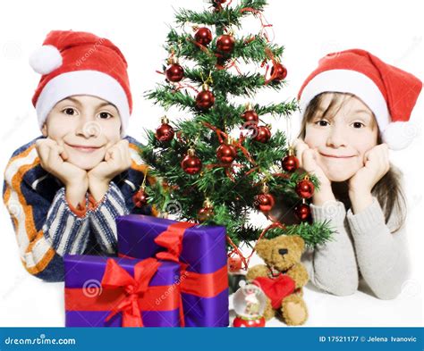 Happy Kids With Santa Hats And Christmas Tree Stock Image Image Of