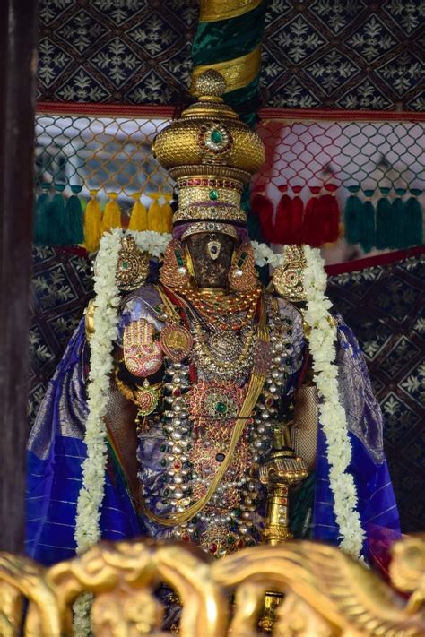 An Idol Is Displayed In Front Of A Wall