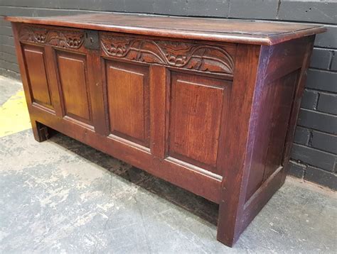 Lot 18th Century Oak Chest With Hinged Panel Top Foliate Carved Frieze And Unusually Side