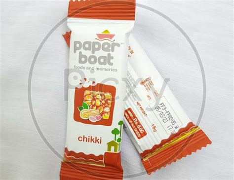 Image Of Closeup Of Paper Boat Chikki Or Peanut Bar Pack No Added