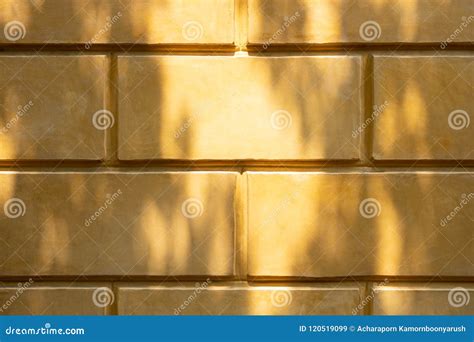 Yellow Brick Wall In The Roman Era For Background With Shadow Stock ...