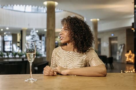 A Woman Drinking in a Bar · Free Stock Photo