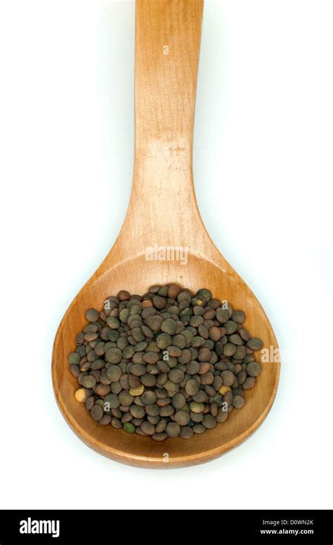 Lentil In Wooden Spoon On White Background Stock Photo Alamy