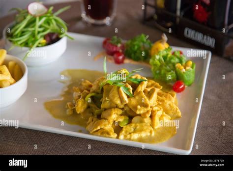 chicken with curry sauce Stock Photo - Alamy