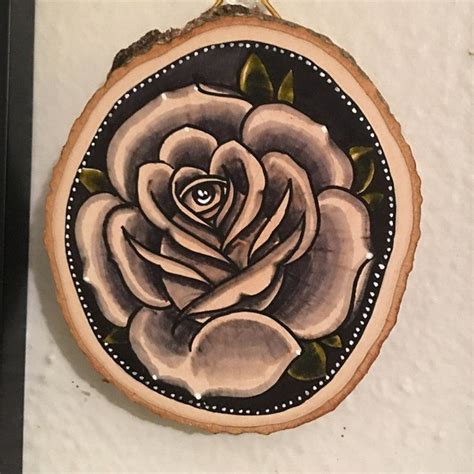 Large Wood Slice With An Original Drawing Of A Wolf And Flowers Tattoo