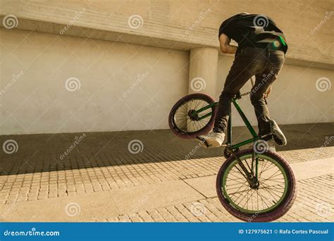 Guy Riding A Bmx Bike On The Street Freestyle Bmx In The City Stock