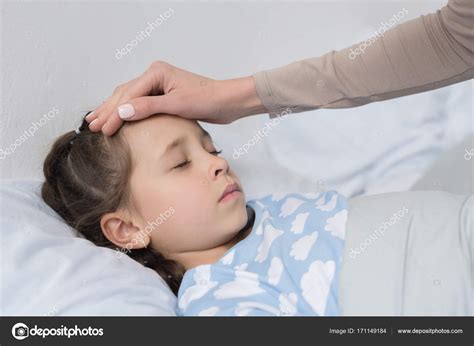 Mother Touching Daughters Forehead Stock Photo Allaserebrina