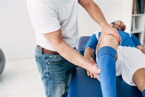 Physiotherapist Massaging Leg Of Football Player On Massage Table Stock Image Image Of Patient