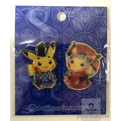 Two Pokemon Pin Badges Sitting On Top Of Each Other