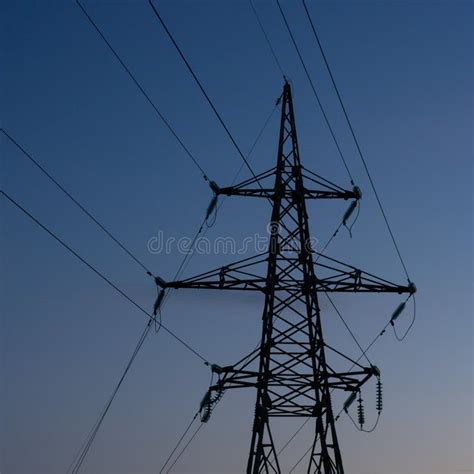 High Voltage Electric Tower Silhouette At Sunset Time And Sky On