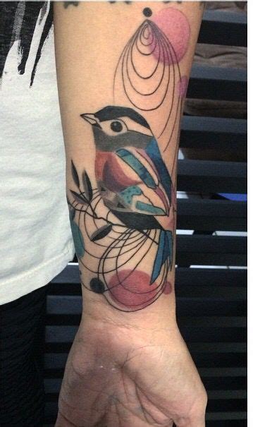 A Bird Tattoo On The Wrist And Arm