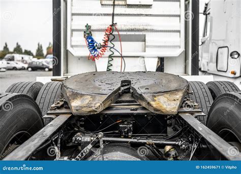 Back View Of Big Rig Semi Truck Tractor With Fifth Wheel And Chassis